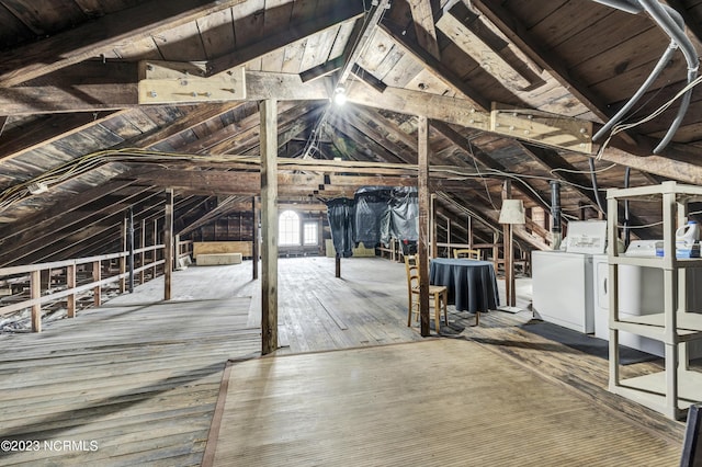 attic with washer and clothes dryer