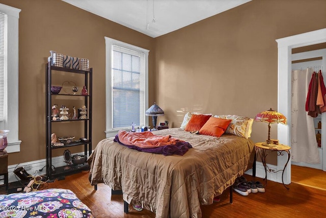 bedroom featuring wood finished floors