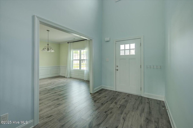 2022 Tarpon Trl, New Bern, NC 28562 - entryway with a chandelier, wood finished floors, baseboards, and wainscoting