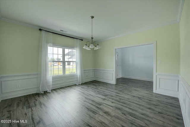 2022 Tarpon Trl, New Bern, NC 28562 - unfurnished dining area with a chandelier, wood finished floors, crown molding, and a wainscoted wall