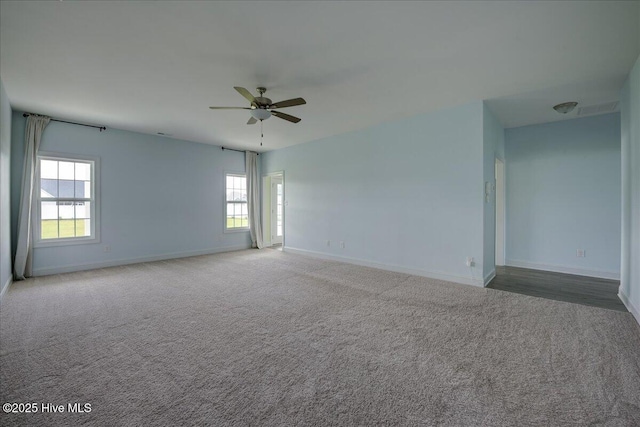2022 Tarpon Trl, New Bern, NC 28562 - carpeted empty room with baseboards and healthy amount of natural light