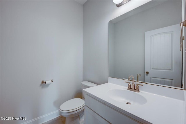2022 Tarpon Trl, New Bern, NC 28562 - half bathroom featuring toilet, vanity, tile patterned floors, and baseboards
