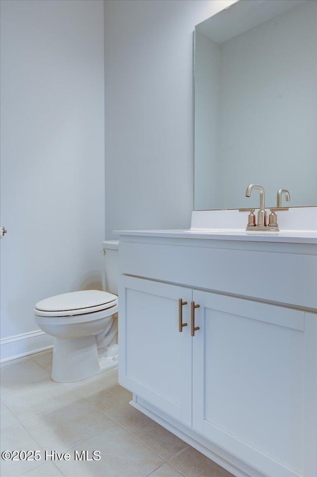 2022 Tarpon Trl, New Bern, NC 28562 - bathroom with toilet, tile patterned flooring, baseboards, and vanity