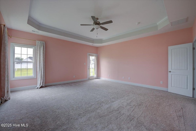 2022 Tarpon Trl, New Bern, NC 28562 - carpeted empty room featuring a tray ceiling, ceiling fan, crown molding, plenty of natural light, and baseboards