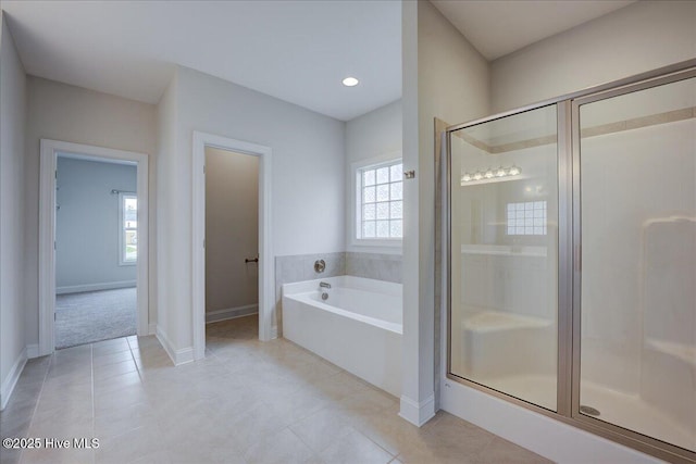 2022 Tarpon Trl, New Bern, NC 28562 - bathroom with healthy amount of natural light, a bath, a shower stall, and tile patterned flooring