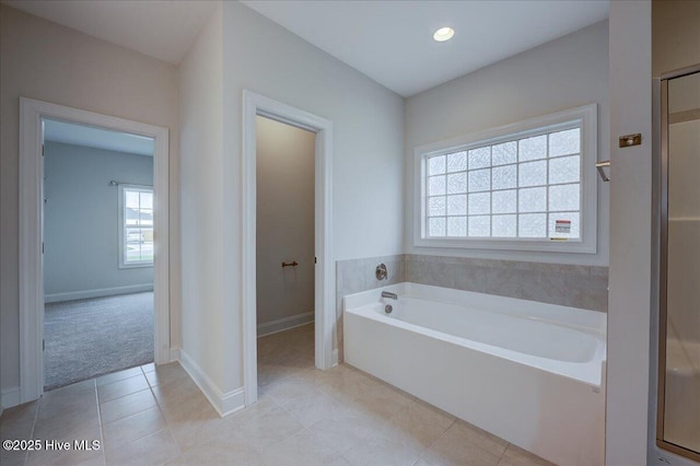 2022 Tarpon Trl, New Bern, NC 28562 - bathroom with a bath, tile patterned flooring, and baseboards