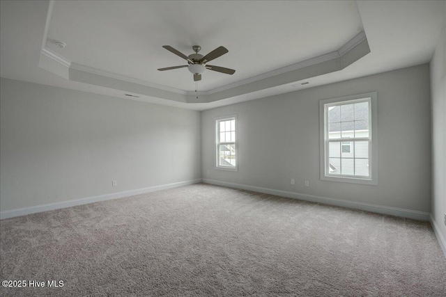 2022 Tarpon Trl, New Bern, NC 28562 - carpeted empty room with a tray ceiling, ornamental molding, a ceiling fan, and baseboards