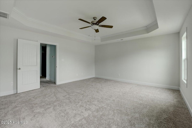 2022 Tarpon Trl, New Bern, NC 28562 - spare room with a tray ceiling, ornamental molding, ceiling fan, carpet flooring, and baseboards