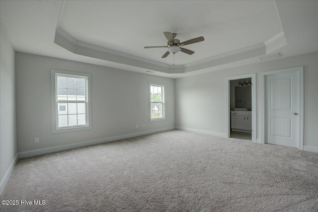 2022 Tarpon Trl, New Bern, NC 28562 - unfurnished bedroom with a raised ceiling, ornamental molding, baseboards, and carpet floors