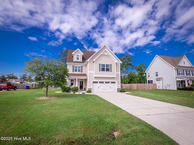 view of front of house with an attached garage, fence, concrete driveway, a front lawn, and board and batten siding