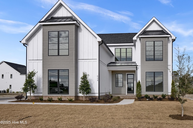 modern farmhouse featuring a front lawn