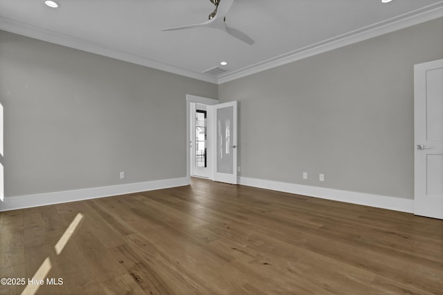 unfurnished room featuring hardwood / wood-style flooring, ceiling fan, and ornamental molding