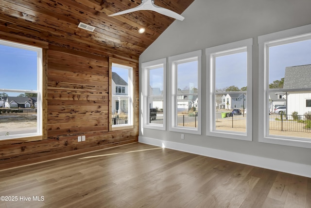 unfurnished sunroom with vaulted ceiling, ceiling fan, and wood ceiling