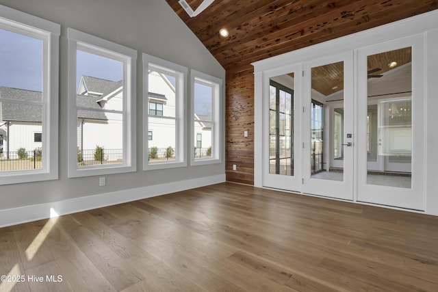 unfurnished sunroom featuring french doors, wooden ceiling, and lofted ceiling