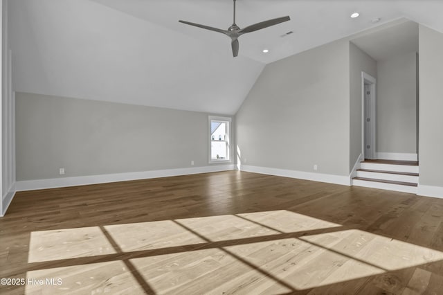 interior space featuring hardwood / wood-style floors, ceiling fan, and vaulted ceiling