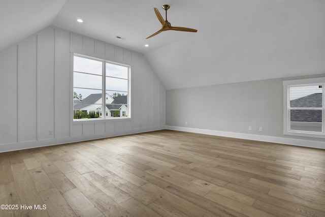 bonus room featuring light hardwood / wood-style flooring, vaulted ceiling, and ceiling fan