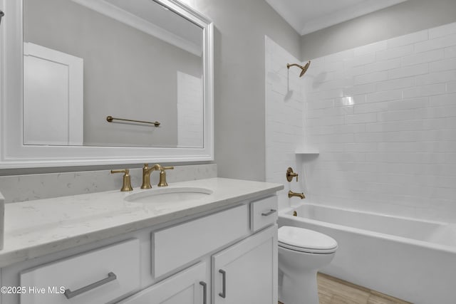 full bathroom with vanity, toilet,  shower combination, and crown molding