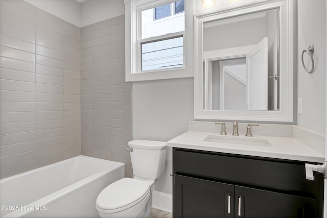 full bathroom featuring vanity, toilet, and tiled shower / bath