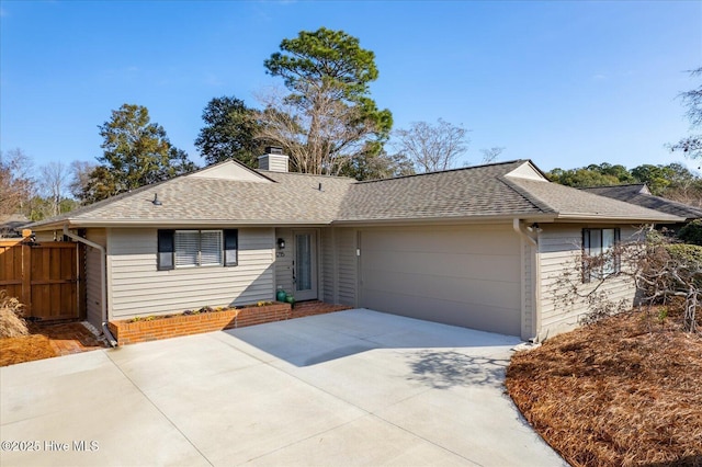 ranch-style home featuring a garage