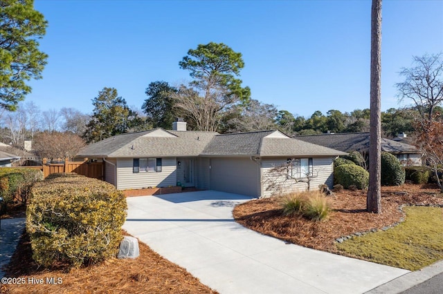 ranch-style home featuring a garage