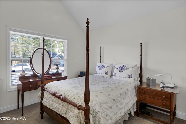 bedroom with carpet flooring and vaulted ceiling