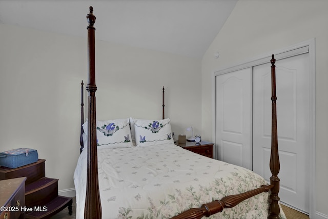 bedroom with a closet and lofted ceiling