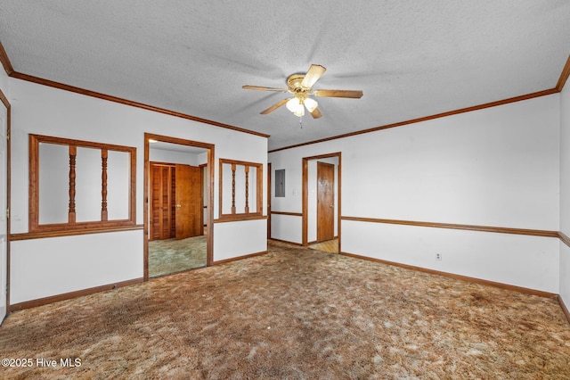 carpeted empty room with a textured ceiling, electric panel, ceiling fan, and crown molding