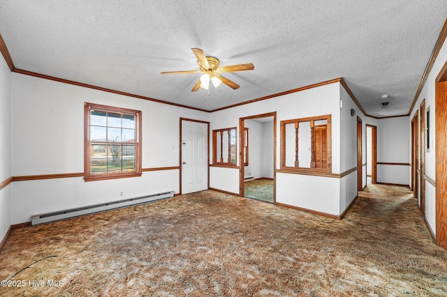 carpeted spare room with a textured ceiling, crown molding, ceiling fan, and a baseboard heating unit