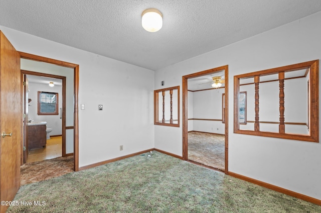 unfurnished bedroom featuring carpet flooring, a closet, and a textured ceiling