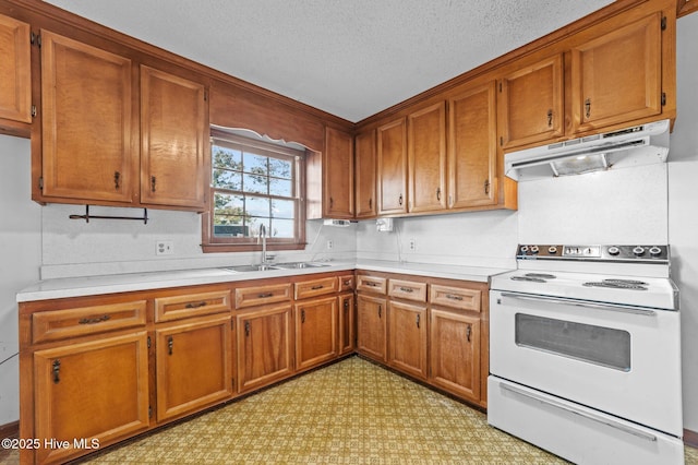 kitchen featuring a textured ceiling, white range with electric cooktop, and sink