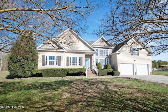 front of property with a front yard and a garage