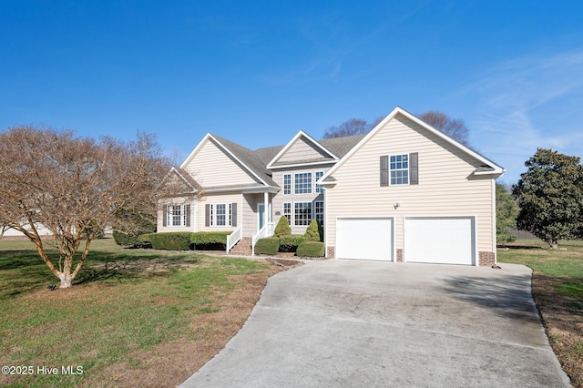 view of front of property featuring a front yard and a garage