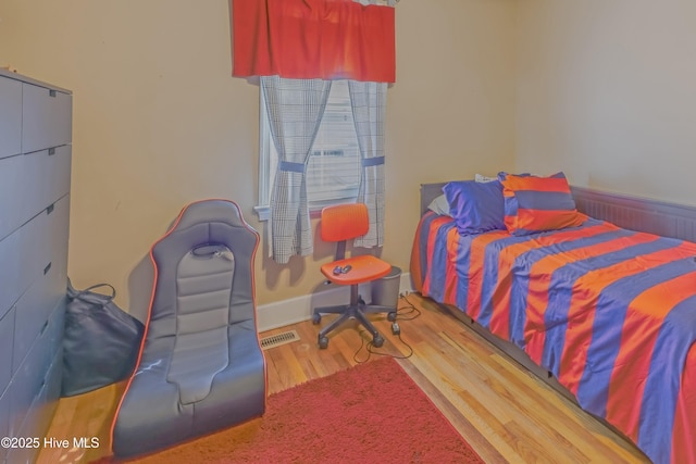 bedroom featuring hardwood / wood-style floors