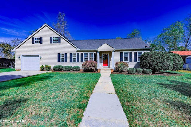 view of front of home with a front lawn and a garage