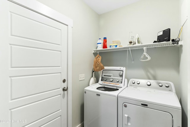 laundry room with washing machine and clothes dryer