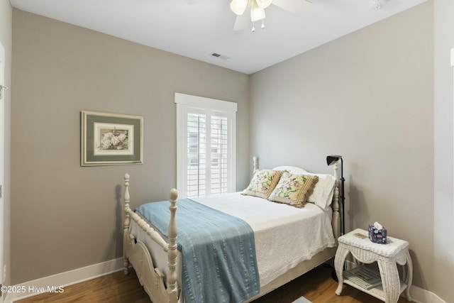 bedroom featuring dark hardwood / wood-style floors and ceiling fan