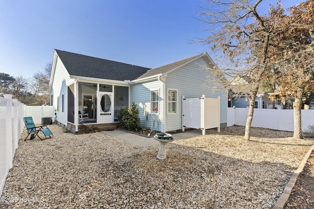 view of front of house with a sunroom and cooling unit