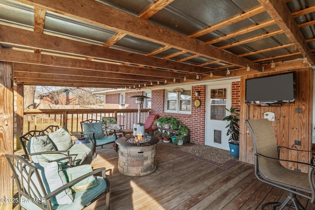 wooden terrace featuring outdoor lounge area