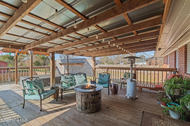 deck with an outdoor fire pit