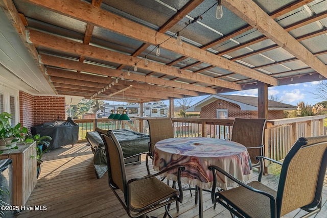 wooden deck featuring a grill and a hot tub