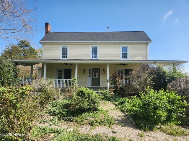 farmhouse inspired home featuring covered porch