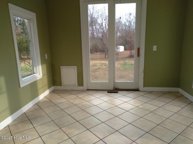 doorway featuring light tile patterned floors