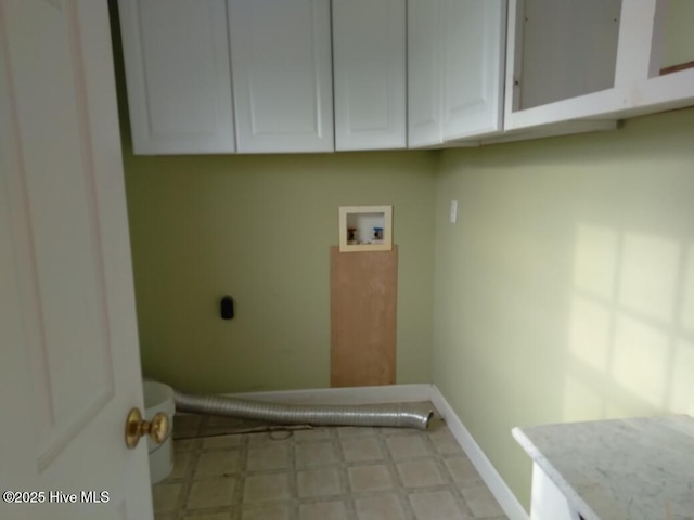 washroom featuring washer hookup, cabinets, and hookup for an electric dryer