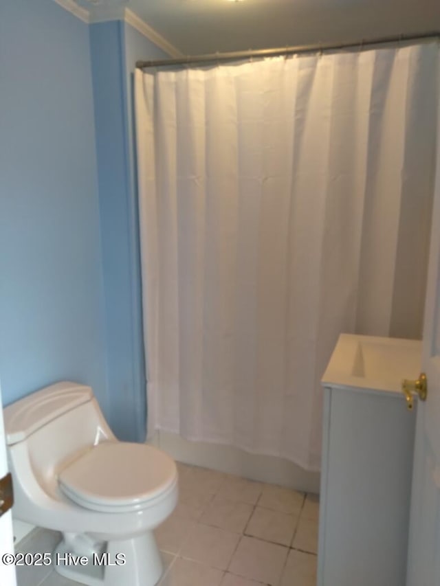 full bathroom featuring tile patterned flooring, ornamental molding, vanity, toilet, and shower / bathtub combination with curtain