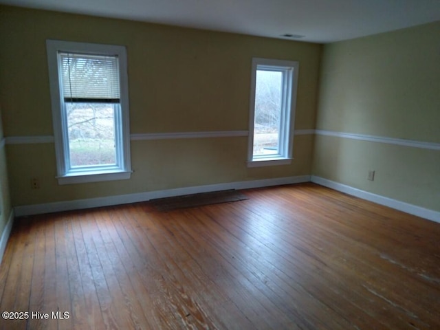 spare room featuring hardwood / wood-style flooring