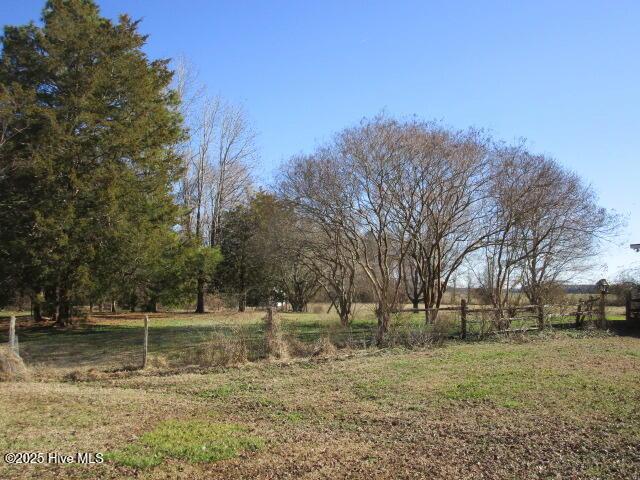 view of yard with a rural view