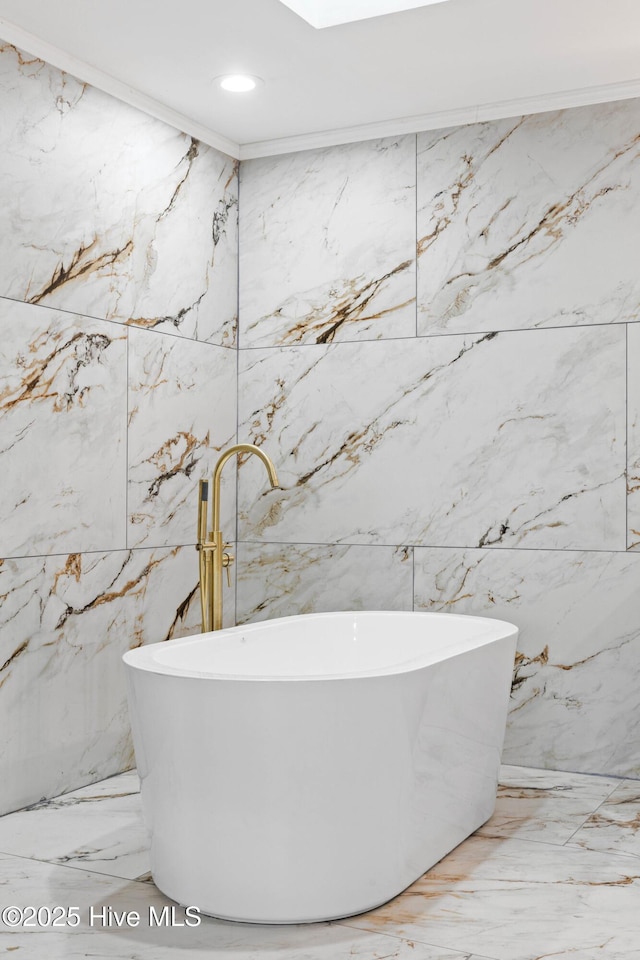 bathroom featuring a bathing tub and ornamental molding