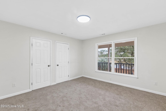 unfurnished bedroom with carpet flooring