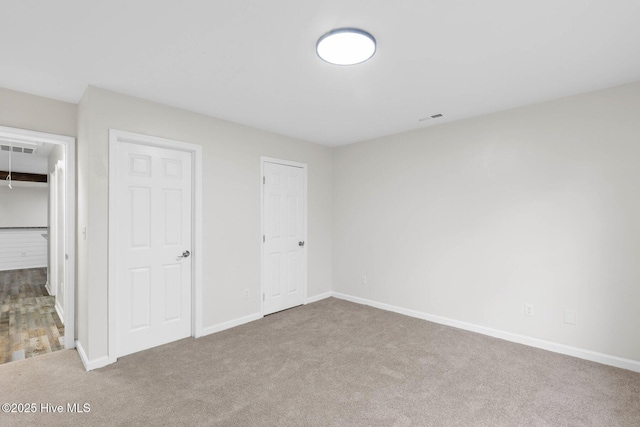 unfurnished bedroom featuring carpet flooring