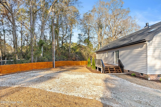 view of yard featuring a wooden deck